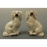 A pair of Victorian Staffordshire type dogs, modelled as spaniels, 17 cm
