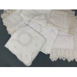 Antique whitework embroidered tea table and tray linens, including examples of cutwork, drawn thread