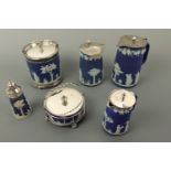 A group of Victorian Wedgwood Jasper Ware comprising three lidded jugs, a biscuit barrel and