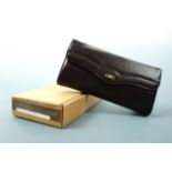 A Bally brown leather Glenda pattern clutch handbag in original packaging