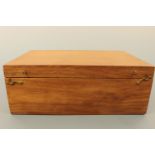 A teak collectors' chest, opening to reveal a number of removable trays, 30 cm x 20 cm x 11 cm