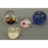 Four Caithness paperweights including Moonflower, Swirly Whirly etc.