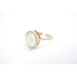 An oval moonstone cabochon and 9 ct gold ring, N/O