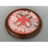 A Victorian beadwork teapot stand / tray, decorated with ivy leaves over a red gros point ground,