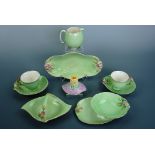Royal Winton green ground blossom pattern table ware and a floral chamber stick