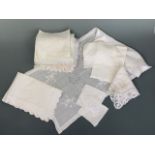 A quantity of antique whitework hand-embroidered tea tray liners