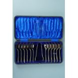 A cased set of twelve electroplate teaspoons and sugar tongs