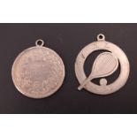 A George V silver tennis fob medallion, reticulated and engraved in depiction of a racket and