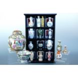 A Franklin Porcelain "Treasures of The Imperial Dynasties" set of miniature ceramic vases, in a wall