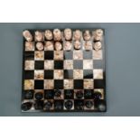 A marble chess set and board, 26 cm x 26 cm