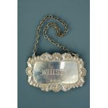 A silver whisky decanter label