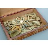 A wooden box containing a collection of sundry coins and metal detector finds