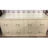 A painted Victorian pine low chest of drawers, having a glass top, 158 cm x 54 cm x 70 cm high