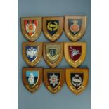 A collection of military regimental plaques, each 18 x 15 cm