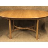 An Ercol elm extendable dining table and six chairs, table 162 x 108 cm (when closed)