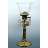 A Victorian cut glass and brass oil lamp together with an Art Nouveau etched glass shade, 49 cm