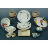 A collection of Gray's Pottery hand decorated ceramics, including three napkin rings, a tea pot,
