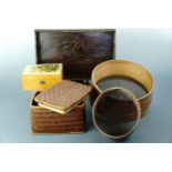 A vintage wooden tea tray, sieves, a Mauchline ware sewing / trinket box and a rattan box