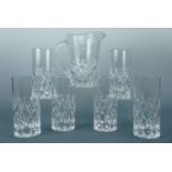 Six tall cut glass drinks glasses and a matching jug