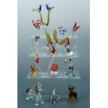 A collection of Bimini type lampwork glass animals, and a porcelain fish, tallest 14 cm