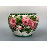 A Wemyss Ware cachepot or planter, oviform and spirally lobed, decorated with pink cabbage roses, 24