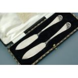 A 1950s cased silver butter knife set