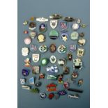 A collection of vintage bowling club, automotive mark and other badges, including Jaguar, Triumph,
