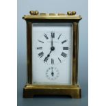 A Mappin and Webb brass carriage clock, 15 cm high
