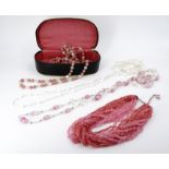 A vintage opera length / "Flapper" glass bead necklace, 66 cm drop, together with two further