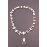 A vintage white metal and faux moonstone princess necklace, having claw-set glass cabochons