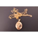 A 9ct gold locket on chain, having relief-moulded decoration incorporating love hearts, and a fine