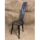 An early 20th Century carved oak spinning stool