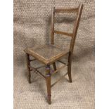 A Victorian cane-seated bedroom chair