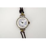 An early 20th Century lady's Numa wristlet watch, having a mother-of-pearl back and bezel, (over-