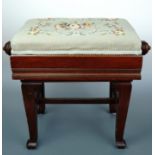 A fine early 20th Century mahogany piano stool with rise-and-fall mechanism