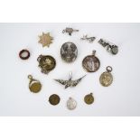 Victorian and later fobs and brooches, including a novelty miniature prayer reel fob, a rolled-