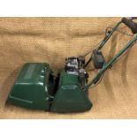 An Atco Balmoral 14S cylinder petrol lawn mower and grass box together with QX scarifier cassette 35
