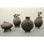 A group of oriental cast iron vessels, tallest 14cm