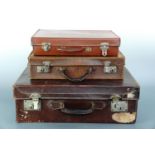 Two vintage hide suitcases and a small faux-leather case, largest 50 x 30 x 17 cm