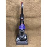 A Dyson DC33 upright vacuum cleaner