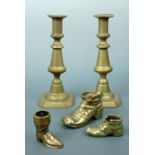 A pair of Victorian brass push-eject candlesticks together with novelty cast brass spill vases