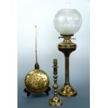 A brass columnar oil lamp 70 cm high, together with a brass lamp base 32 cm high and brass