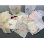 A quantity of mid-20th Century machine embroidered table linens, including four organza-types, one