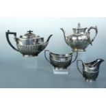 An Edwardian electroplate three-piece tea service of Georgian form, with engraved dedication "