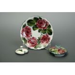 Three items of Wemyss Ware, including a saucer, decorated with a cabbage rose wreath, a similarly