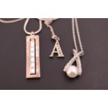 Contemporary white metal jewellery including an "A" initial pendant, a faux pearl and paste