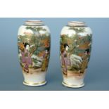 A pair of Japanese Satsuma miniature vases, of slender ovoid form, each decorated in depiction of