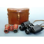 A cased set of 1950s Wrayvu 8 x 30 binoculars and one other set