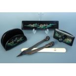 A black Japanned desk set and paper knives