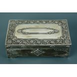 An early 20th Century Anglo-Indian white metal table cigarette box, the base bearing the engraved